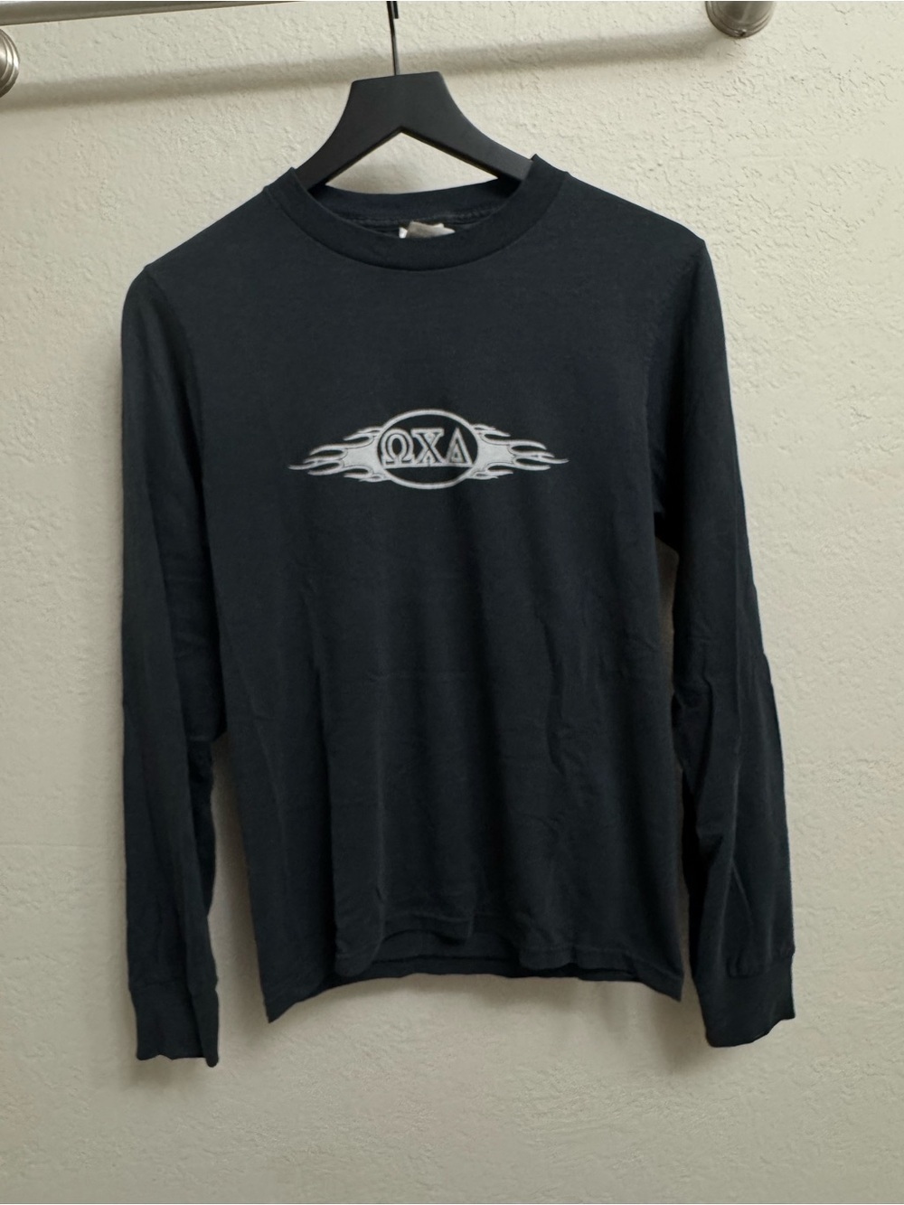 Vintage Black Long-Sleeve omega Graphic Tee with White Flame Logo